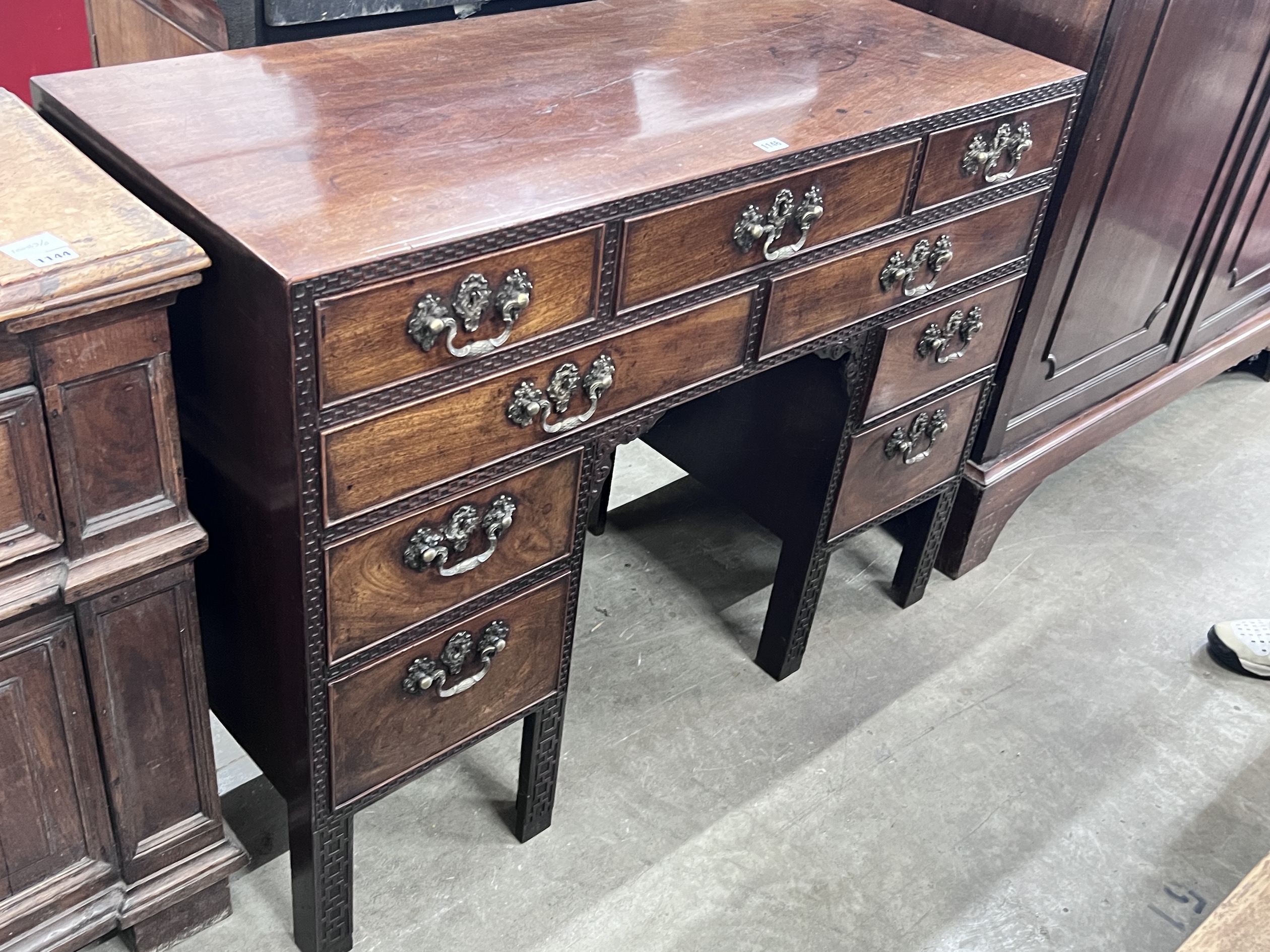 A George III Chippendale style mahogany blind fret kneehole desk, width 112cm, depth 48cm, height 87cm.